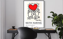 Load image into Gallery viewer, Men Holding Heart by Keith Haring, 1988
